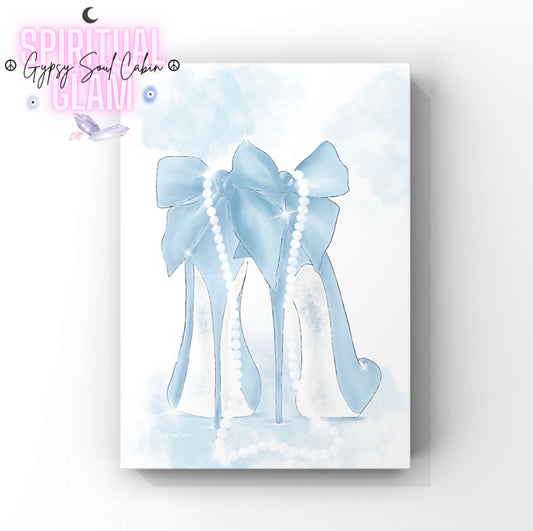 Illustration of a pair of blue fashion heels with a large bow, draped with a string of pearls, set against a light, watercolour background.