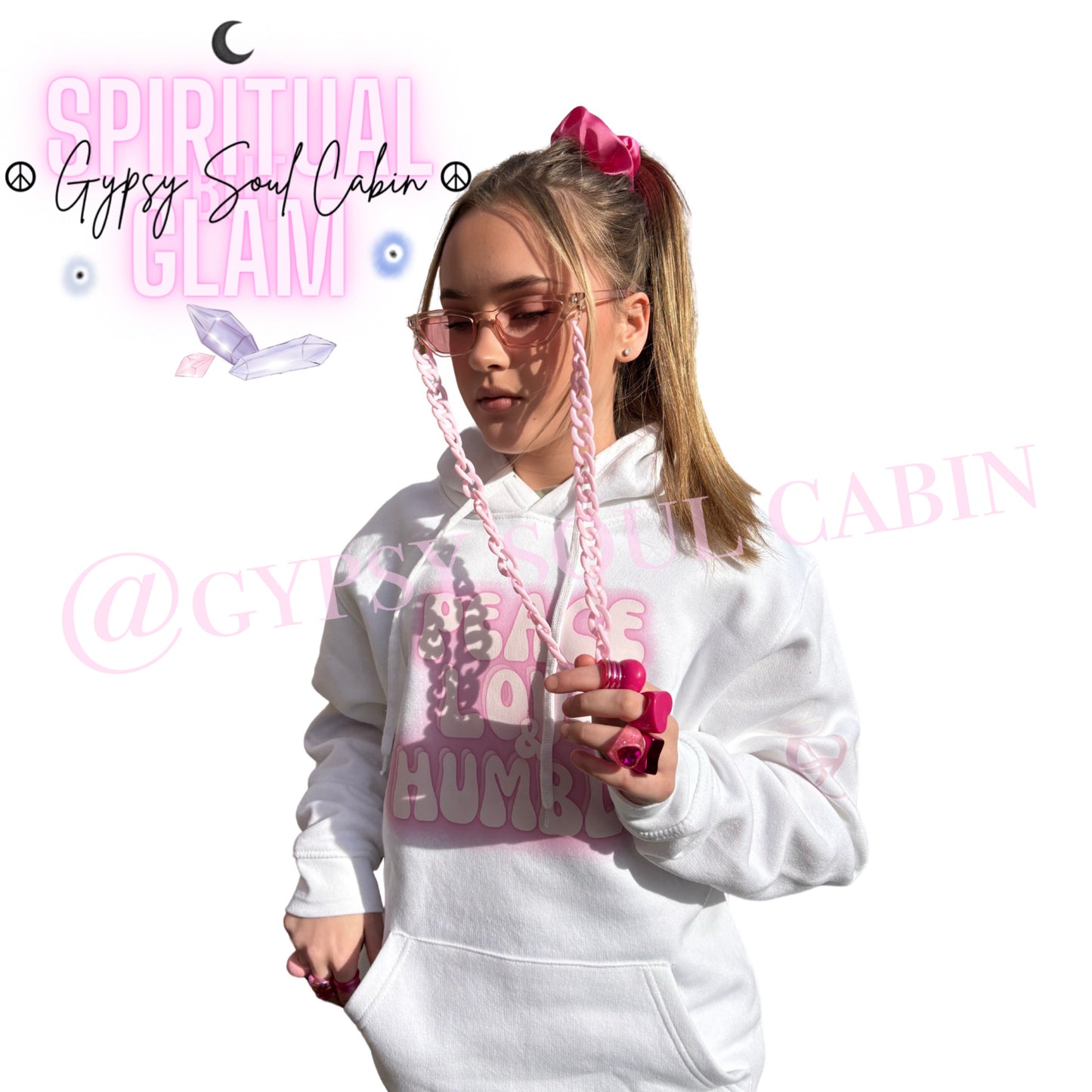 Full lookbook view of a model showcasing chunky pink Y2K retro rings on both hands styled with a matching pink hair scrunchie, sunglasses chain, and a white Peace Love Humble hoodie by Gypsy Soul Cabin.