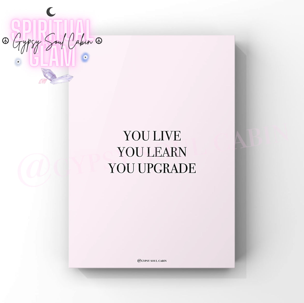 Empowering growth mindset wall decor print featuring the motivational slogan “You live, you learn, you upgrade” in clean black typography over a soft pastel pink setting