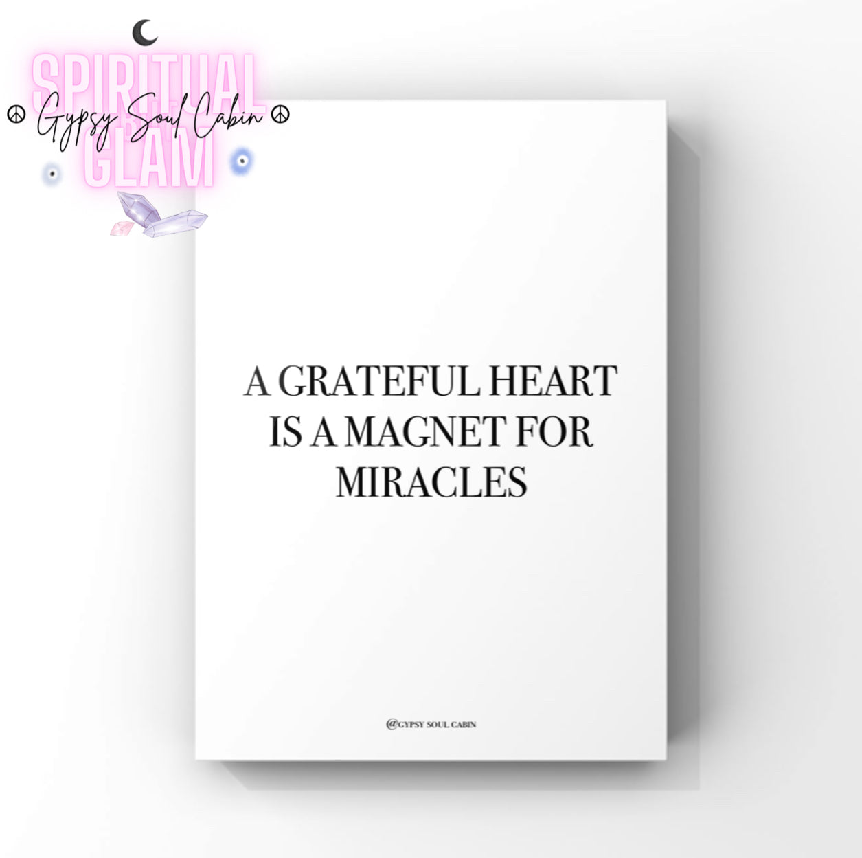 Black & white poster print with motivational quote 'A grateful heart is a magnet for miracles' on a white background.