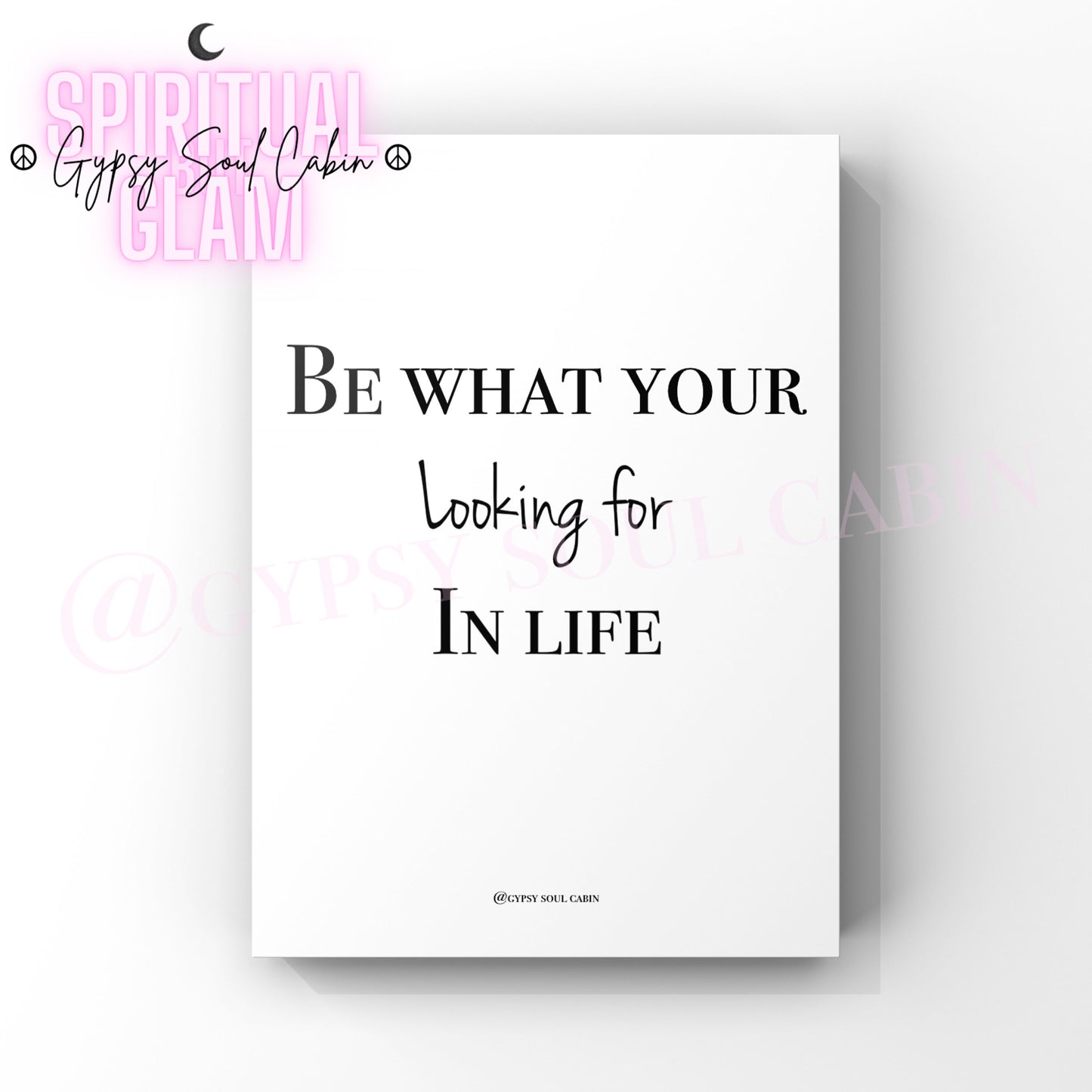 A black and white quote print with the text 'BE WHAT YOUR LOOKING FOR IN LIFE' with a white background.