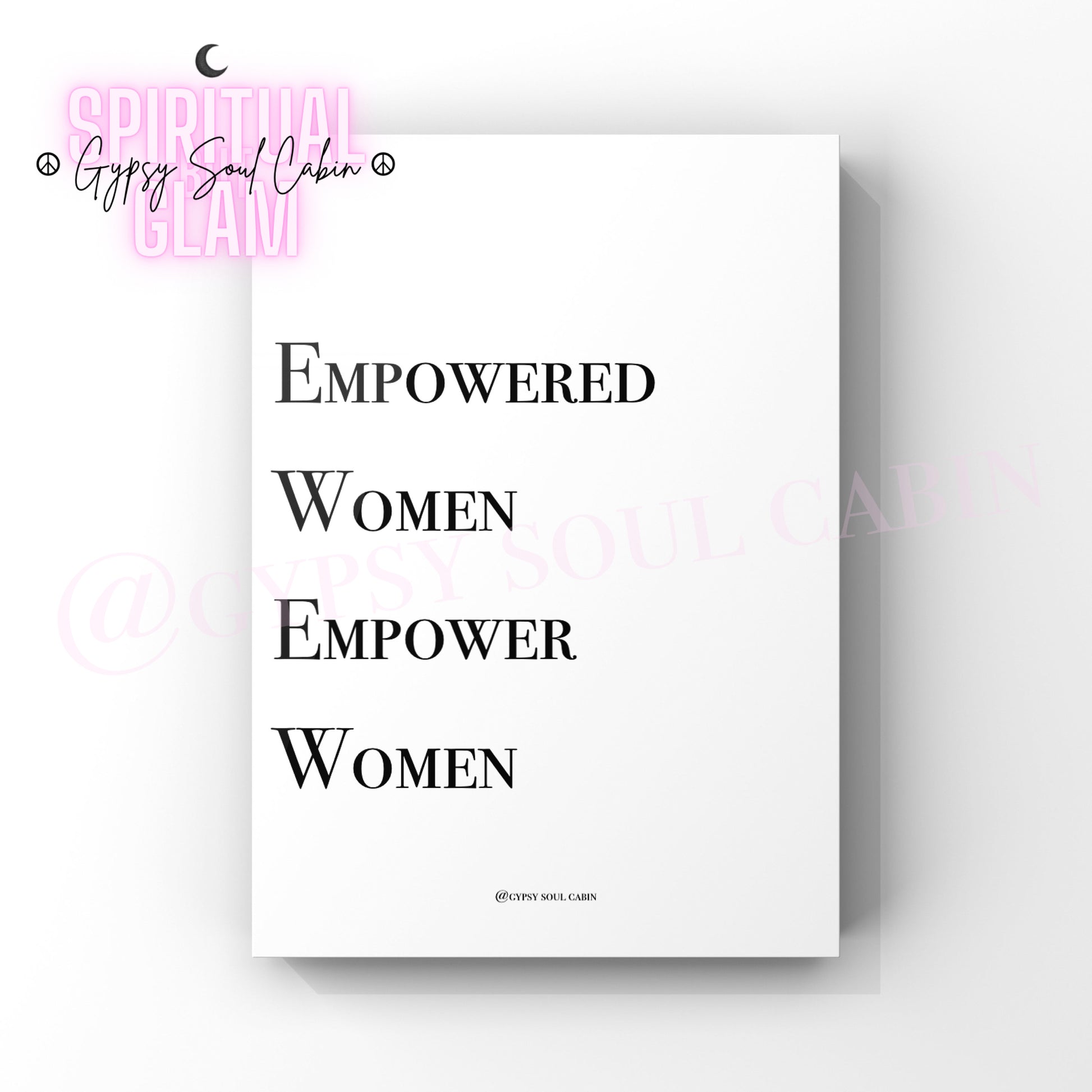 Minimalist black and white typography print with the words 'Empowered Women,' 'Empower,' and 'Women' in bold serif fonts, arranged vertically on a white background, designed as an empowering wall decor.