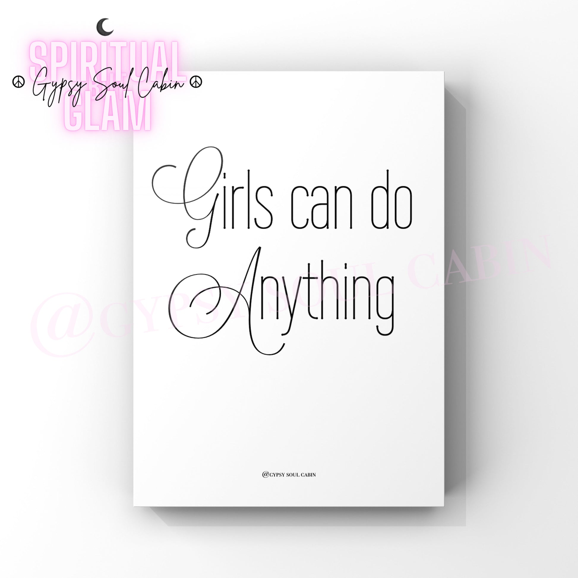 Minimalist white wall print with the quote 'Girls can do Anything' in elegant black script and sans-serif fonts, designed to inspire confidence and empowerment.