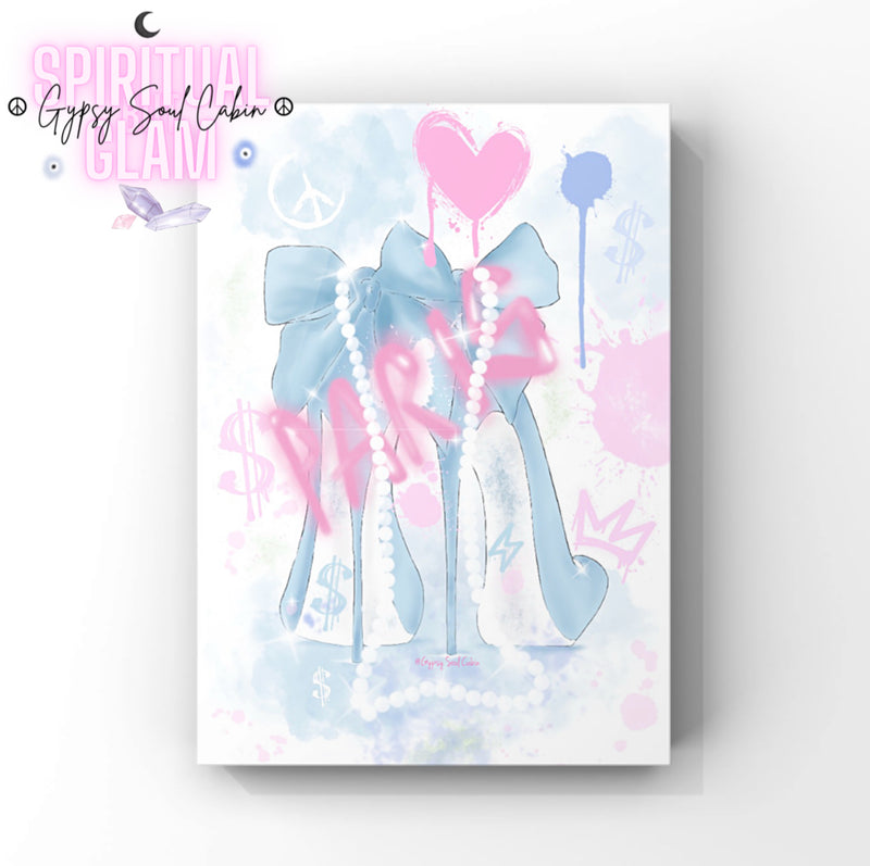 A graffiti-style fashion art print featuring blue fashion heels with white pearls, a pink heart, dollar signs, a crown, and pastel paint splatters.