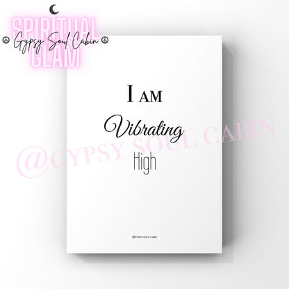 A black and white quote print with the text 'I AM VIBRATING AT A HIGH FREQUENCY' on a white background.