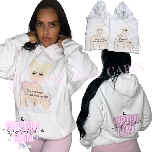 An oversized white hoodie with front pocket featuring artwork of a female figure on the front and a logo on the back.