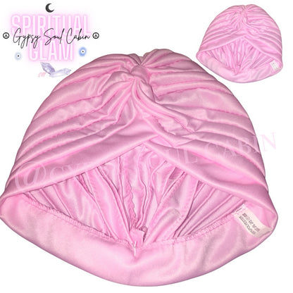 Close-up of a pale pink satin bohemian gypsy head wrap, showcasing its soft fabric and stylish design, perfect for summer and beach accessories.