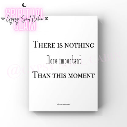 A black and white quote print with the text 'There is nothing more important than this moment' on a white background.