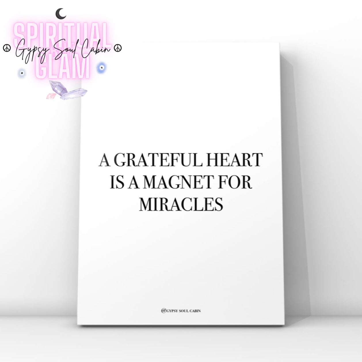 High-vibe gratitude wall art print featuring the motivational spiritual slogan “A Grateful Heart Is A Magnet For Miracles” in clean black lettering.