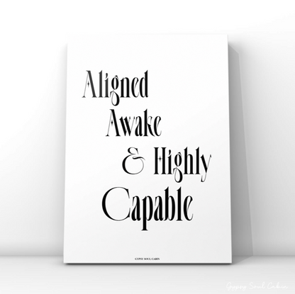 Sleek black and white motivational print displaying the text Aligned Awake & Highly Capable in a modern serif font.