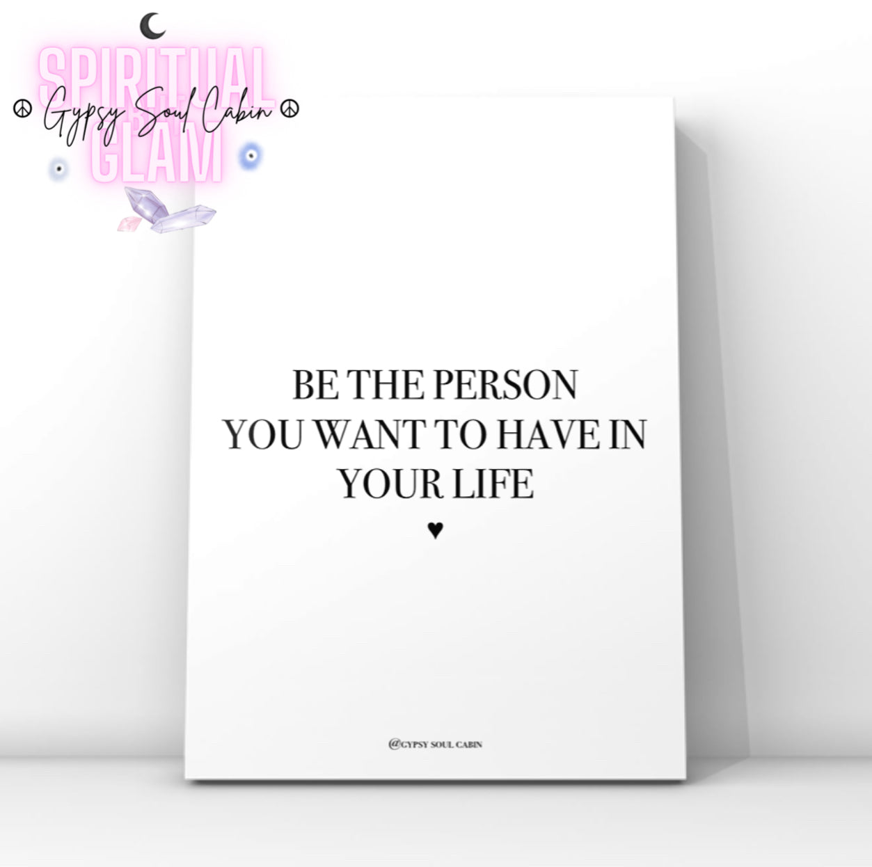 Clean minimalist typography print featuring the inspirational self-love quote "Be The Person You Want To Have In Your Life," with a small black heart icon underneath.