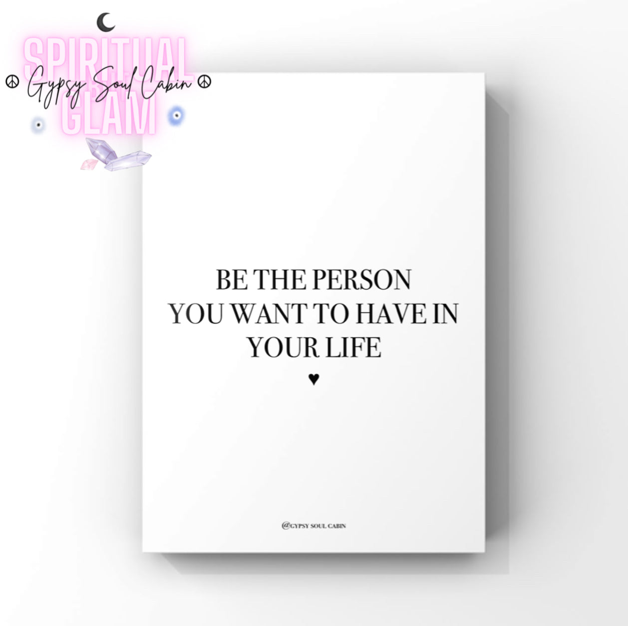 Clean minimalist typography print featuring the inspirational self-love quote "Be The Person You Want To Have In Your Life," with a small black heart icon underneath.