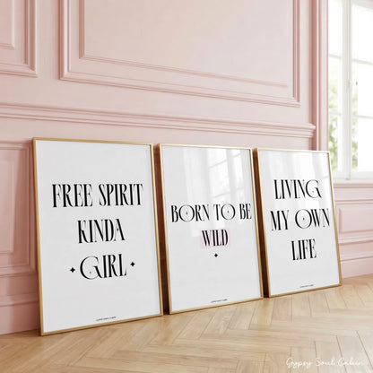 Set of three minimalist black and white typography prints on a bright white background featuring Free Spirit Kinda Girl, Living My Own Life, and Born To Be Wild.