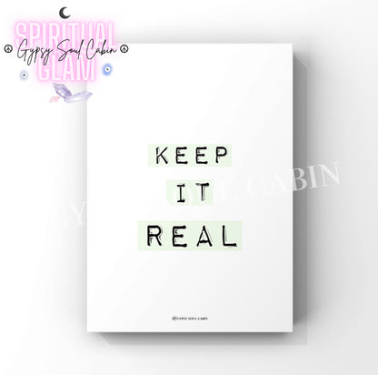 Minimalist wall art print showcasing the inspirational slogan “Keep It Real” printed on three pieces of light sage green label maker tape.