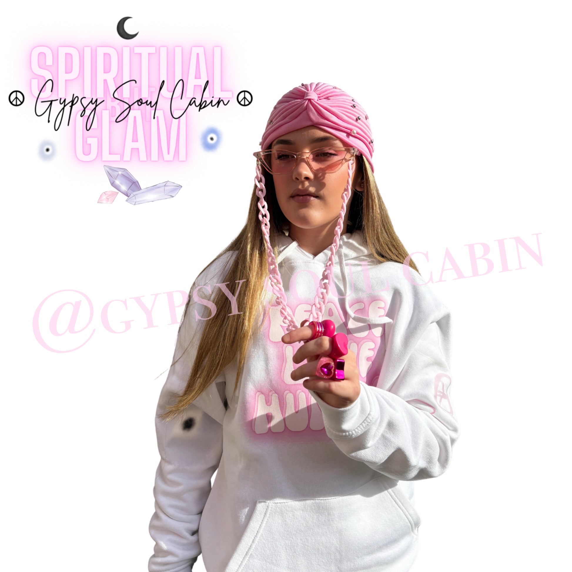 A centred product lookbook view showcasing a model wearing chunky pink Y2K retro fashion rings, a pink sunglasses chain, a pleated head wrap turban, and a white Peace Love Humble airbrush graphic hoodie by Gypsy Soul Cabin.
