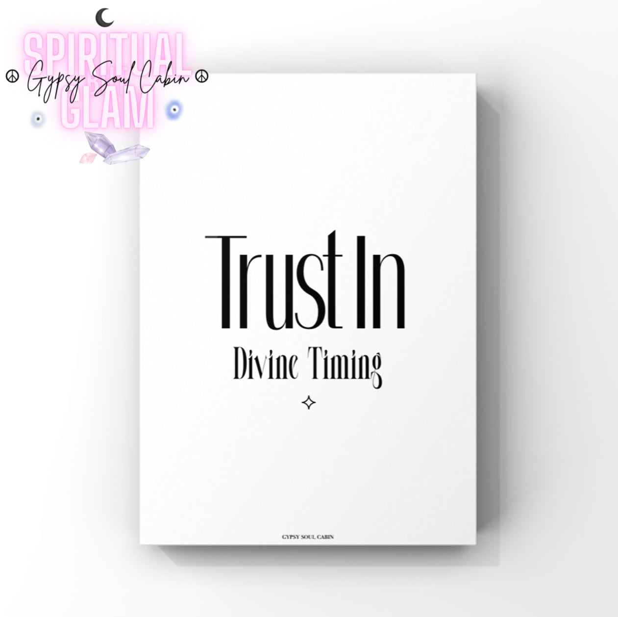 Minimalist spiritual wall art print reading "Trust In Divine Timing," centred on a crisp background with a small matching protective diamond emblem.