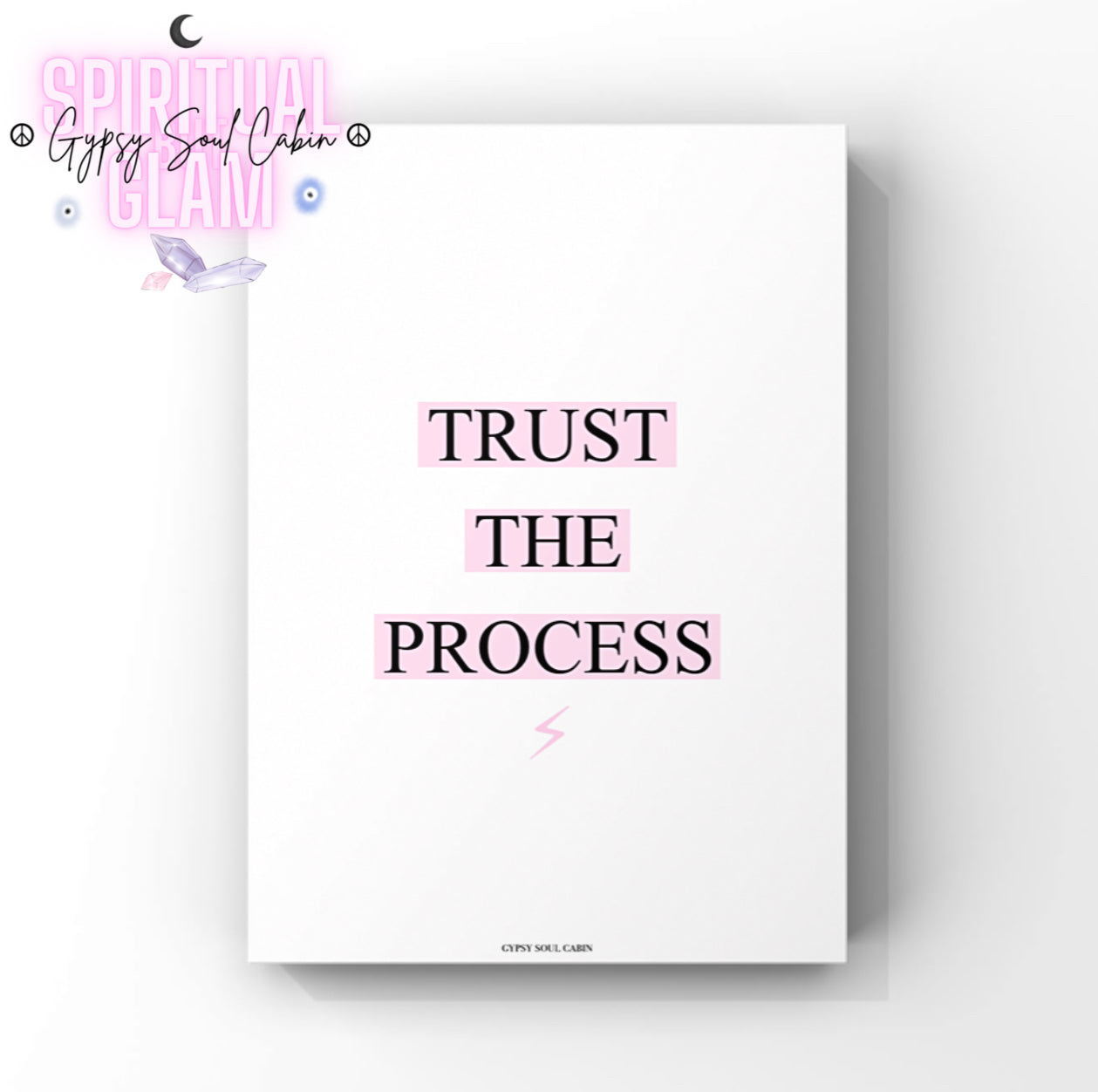 Minimalist motivation wall decor print featuring the quote "Trust The Process," with pink-highlighted text boxes and a tiny pink lightning bolt icon at the bottom.